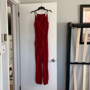 New never worn size small wine jump suit